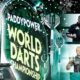 This poster depicts the PDC World Darts Championship 2026, which is underway and drawing enthusiastic fans.
